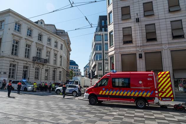 Emergency services pictured on the site of an explosion at the Treurenberg in the city center of Brussels, Friday 14 August 2026. According to the first information, two explosion happened in a building which was evacuated earlier in the day after a gas leak was detected, injuring two people.  EMILExWINDAL 1081058064st
