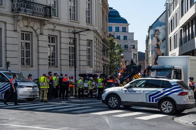 Emergency services pictured on the site of an explosion at the Treurenberg in the city center of Brussels, Friday 14 August 2026. According to the first information, two explosion happened in a building which was evacuated earlier in the day after a gas leak was detected, injuring two people.  EMILExWINDAL 1081058065st