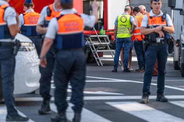 Emergency services pictured on the site of an explosion at the Treurenberg in the city center of Brussels, Friday 14 August 2026. According to the first information, two explosion happened in a building which was evacuated earlier in the day after a gas leak was detected, injuring two people.  EMILExWINDAL 1081058068st