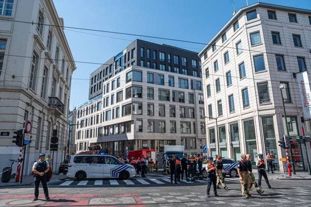 Emergency services pictured on the site of an explosion at the Treurenberg in the city center of Brussels, Friday 14 August 2026. According to the first information, two explosion happened in a building which was evacuated earlier in the day after a gas leak was detected, injuring two people.  EMILExWINDAL 1081058074st