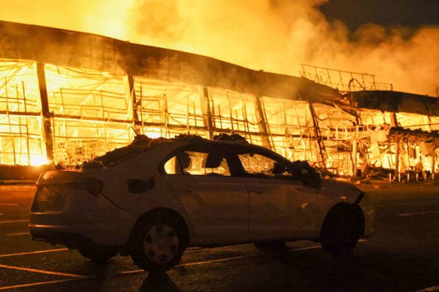 RUSSIA, DONETSK PEOPLE S REPUBLIC - AUGUST 14, 2026: A fire breaks out after a Ukrainian drone strike on the Galaktika Galaxy shopping centre in Yenakiyevo, northeast of Donetsk. Dmitry Yagodkin TASS  96146243