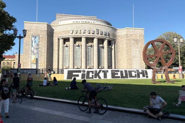 August 14, 2026: The Volksbühne Berlin set up a temporary, free swimming pool on Rosa Luxemburg Platz—the Volksbad —featuring a banner reading Fickt Euch, Fuck You following protests against a private event for Black people, Berlin, Germany