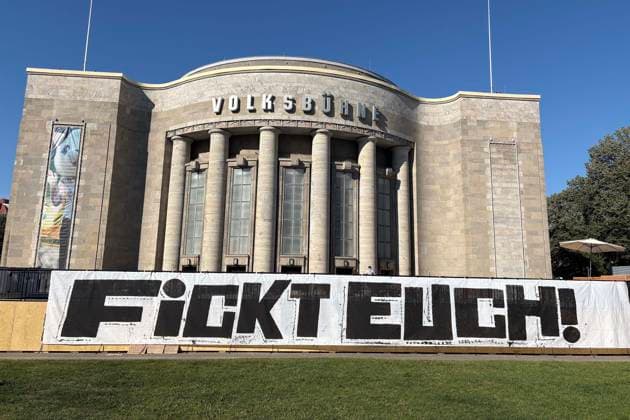 August 14, 2026: The Volksbühne Berlin set up a temporary, free swimming pool on Rosa Luxemburg Platz—the Volksbad —featuring a banner reading Fickt Euch, Fuck You following protests against a private event for Black people, Berlin, Germany