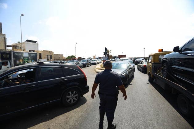 Lebanese families flee north as Israeli strikes persist despite ceasefire SIDON, LEBANON - AUGUST 15: Traffic backs up along roads in Sidon, southern Lebanon, on August 15, 2026, as families flee their homes in vehicles following continued Israeli military strikes despite a ceasefire agreement. Displaced residents packed personal belongings into cars and trucks, creating major gridlock through the port city as they sought safety in regions further north. Mohammad Abushama Anadolu Sidon Lebanon. Editorial use only. Please get in touch for any other usage.  Copyright: x2026xAnadoluxMohammadxAbushamax