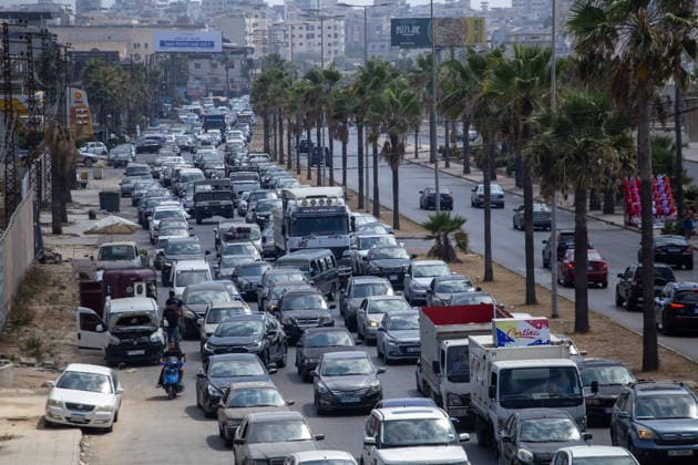 Lebanese families flee north as Israeli strikes persist despite ceasefire SIDON, LEBANON - AUGUST 15: Traffic backs up along roads in Sidon, southern Lebanon, on August 15, 2026, as families flee their homes in vehicles following continued Israeli military strikes despite a ceasefire agreement. Displaced residents packed personal belongings into cars and trucks, creating major gridlock through the port city as they sought safety in regions further north. Mohammad Abushama Anadolu Sidon Lebanon. Editorial use only. Please get in touch for any other usage.  Copyright: x2026xAnadoluxMohammadxAbushamax