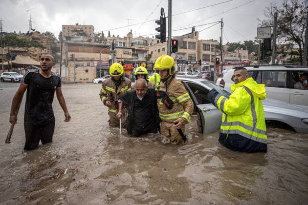 Flash floods submerge vehicles in East Jerusalem neighborhood following heavy rainfall EAST JERUSALEM - AUGUST 15: People wade through flooded roads and submerged vehicles are seen in the Wadi al-Joz neighborhood of East Jerusalem on August 15, 2026, after unseasonal heavy rainfall triggered localized flash flooding across the area. Search and rescue teams were dispatched to the district as rising waters trapped cars, disrupted traffic flow, and damaged infrastructure across low-lying urban streets. Mostafa Alkharouf Anadolu Jerusalem Israel. Editorial use only. Please get in touch for any other usage.  Copyright: x2026xAnadoluxMostafaxAlkharoufx