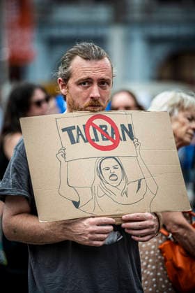 August 15, 2026, Amsterdam, North Holland, The Netherlands Holland: A demonstrator displays an anti-Taliban sign. August 15, 2026, Amsterdam, The Netherlands. Demonstrators gathered on Dam Square, Amsterdam, in solidarity with Afghan women and girls. The protest marked five years of Taliban rule and demanded access to education for women and girls be restored, and an end to Brussels engagement with the Taliban regime. Amsterdam The Netherlands Holland - ZUMAp202 20260815_zip_p202_022 Copyright: xJamesxPetermeierx