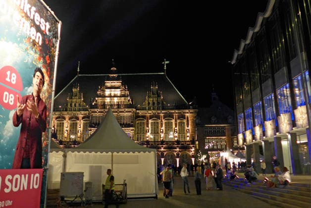 Bremen s Market Square on the opening night of the 37th Bremen Music Festival on August 15, 2026, under the theme A Grand Night of Music. In the center is the historic City Hall; to the right is the Bremen City Parliament.