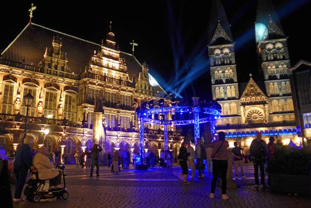 Bremen’s Market Square on the opening night of the 37th Bremen Music Festival on August 15, 2026, under the theme A Grand Night of Music. On the left is the historic City Hall; on the right is Bremen Cathedral.