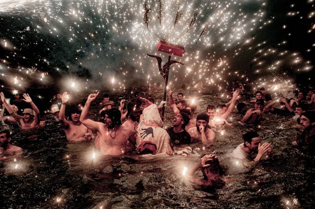 August 15, 2026, Badalona, Spain: People react in the sea as a Correfoc devil sprays fireworks over them during the August Festival in Badalona, north of Barcelona The Correfoc, a traditional Catalan celebration featuring fire-spitting performers, ends in the waters of Badalona beach. Badalona Spain  - ZUMAb137 20260815_fap_b137_004 Copyright: xJordixBoixareux