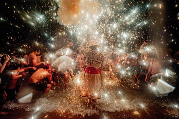 August 15, 2026, Badalona, Spain: People react as a Correfoc devil enters the sea during the August Festival in Badalona, north of Barcelona. The Correfoc, a traditional Catalan celebration featuring fireworks and fire-spitting performers, ends in the waters of Badalona beach. Badalona Spain  - ZUMAb137 20260815_fap_b137_019 Copyright: xJordixBoixareux