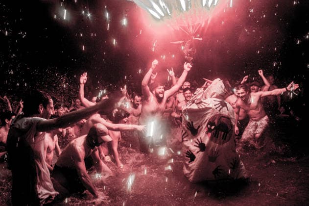 August 15, 2026, Badalona, Spain: People react as a Correfoc devil enters the sea during the August Festival in Badalona, north of Barcelona. The Correfoc, a traditional Catalan celebration featuring fireworks and fire-spitting performers, ends in the waters of Badalona beach. Badalona Spain  - ZUMAb137 20260815_fap_b137_017 Copyright: xJordixBoixareux