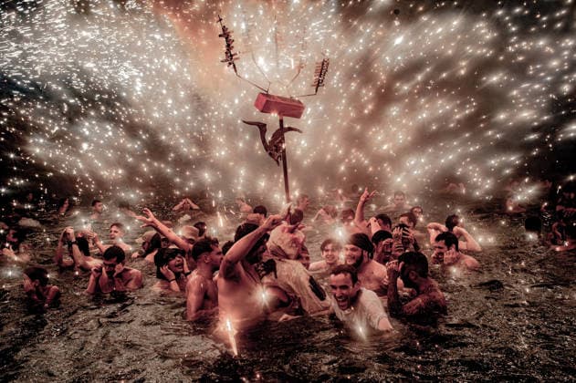 August 15, 2026, Badalona, Spain: People react in the sea as a Correfoc devil sprays fireworks over them during the August Festival in Badalona, north of Barcelona The Correfoc, a traditional Catalan celebration featuring fire-spitting performers, ends in the waters of Badalona beach. Badalona Spain  - ZUMAb137 20260815_fap_b137_015 Copyright: xJordixBoixareux