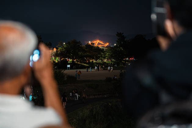 General view, August 16, 2026 - The Kyoto Gozan Okuribi or Five Mountain Bonfires, illuminate the night sky over Kyoto, Japan. The traditional summer observance marks the end of the Obon season, as five mountains surrounding the city are lit with bonfires to send ancestral spirits back to the afterlife.  aflo_341148124