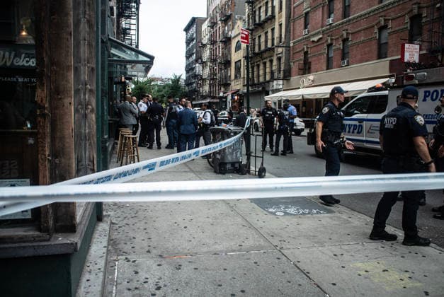 August 16, 2026, New York City, New York, USA: NYPD officers shot and killed a man they said was armed with a butcher s knife inside an apartment building on the Lower East Side Sunday, August 16th, 2026 afternoon. Officers were called out to the building for reports of an assault. When they got there, they said they found a blood trail on the stairs. Officers followed the blood trail, and found a man, identified as 54-year-old Wei Chan, who they said was armed with a butcher s knife. According to the department, officers ordered Chan to show his hands multiple times, and he refused. That s when officers shot Chan. .Wei Chan was taken to a nearby hospital where he was later pronounced dead. The shooting happened around 4 p.m. at a building - ZUMAt442 20260816_znp_t442_005 Copyright: xBillyxTompkinsx