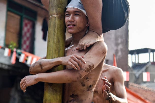 August 17, 2026, Bandung Regency, West Java, Indonesia: Participants climb a pole coated in oil and mud, with prizes placed at the top, during a competition locally known as Panjat Pinang to commemorate the 81st anniversary of the Republic of Indonesia s independence in Lengkong Village, Bandung Regency, Indonesia. Bandung Regency Indonesia - ZUMAr272 20260817_zip_r272_027 Copyright: xDimasxRachmatsyahx