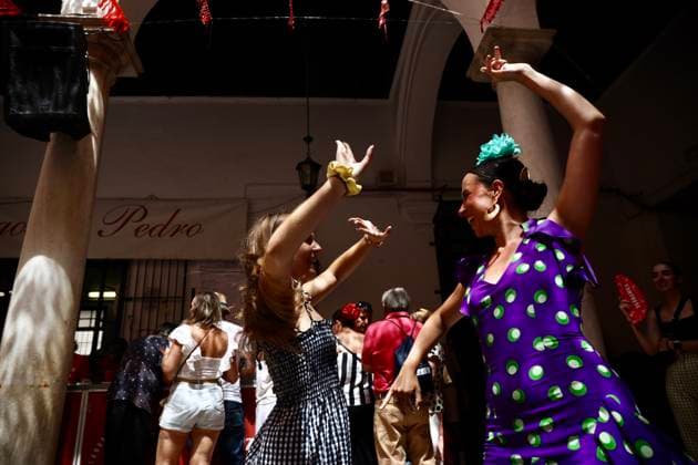 Scene at the 2026 Málaga Fair: Several women, dressed in traditional flamenco outfits, stroll through the Cortijo de Torres grounds during the Málaga Fair. August 17, 2026, in Málaga, Andalusia, Spain. The capital of the Costa del Sol celebrates its big week, during which locals and visitors gather to enjoy the festive atmosphere and the many activities the Feria has to offer. August 17, 2026, in Málaga, Andalusia, Spain Málaga, Andalusia, Spain Spain Copyright: xÃlexxZeax 7718779