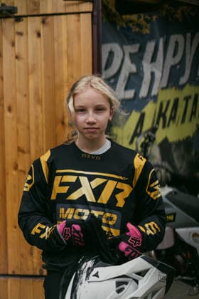 Young female motocross rider portrait in racing gear Minsk, Minsk Region, Belarus R_YUKI26081384-2101343-01 EDITORIAL USE ONLY ,model released, Symbolfoto ,property released