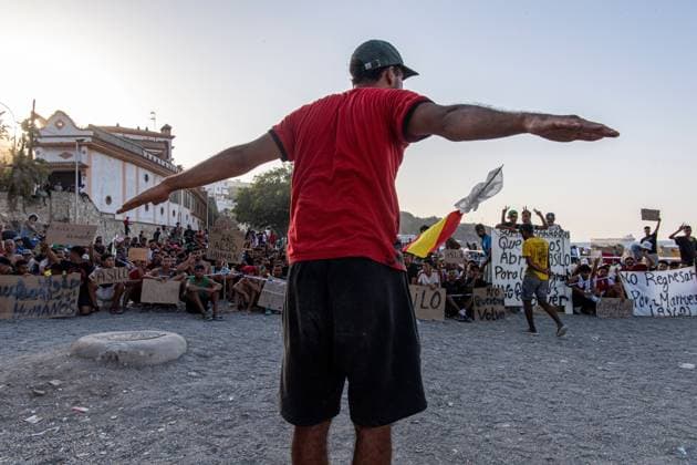 August 17, 2026, Ceuta, Spain: CEUTA, SPAIN Ã¢â‚¬ AUGUST 17, 2026: More than 100 migrants, most of them Moroccan, have been protesting for days in front of National Police vans during the daily food distribution provided by the Spanish Red Cross at TrampoloÂ­n Beach. Ã¢â‚¬oeNo asylum, no foodÃ¢â‚¬Â is the chant repeated by the migrants on the sand, while African migrants continue to stay in the temporary accommodation facilities set up on the Ceuta beach. Authorities are expected to clear the beach in the coming days and transfer the migrants to four reception facilities announced today by SpainÃ¢â‚¬â ¢s Minister for Migration, Elma Saiz. Ceuta Spain - ZUMAq101 20260817_zna_q101_079 Copyright: xAntonioxSemperex