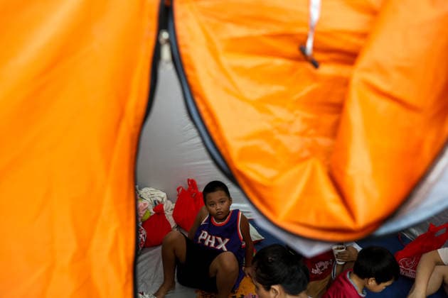 Tens of thousands evacuated in Philippines amid monsoon rains, floods QUEZON CITY, PHILIPPINES - AUGUST 18: People evacuated from flooded areas take shelter at a secondary school basketball court, amid lingering threats of flooding caused by heavy monsoon rains, in Quezon City, Metro Manila, Philippines, on August 18, 2026. As the country remains threatened by floods caused by monsoon heavy rains, tens of thousands of people in the capital region of Metro Manila and its surrounding cities and areas have been evacuated, with schools in multiple locations across the Philippines being suspended for safety reasons. Daniel Ceng Anadolu Quezon City Philippines. Editorial use only. Please get in touch for any other usage. Copyright: x2026xAnadoluxDanielxCengx