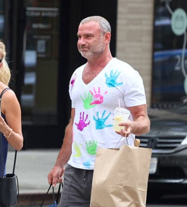 Liev Schreiber With His Wife Out in NYC Actor Liev Schreiber with a funny hand painted tshirt is walking with his wife Taylor Neisen in Soho, New York on August 18, 2026. Photo by Dylan Travis ABACAPRESS.COM New York City New York United States  Copyright: xDylanxTravis ABACAx