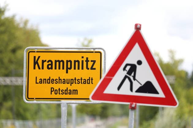 Town entrance sign and construction sign at the new Krampnitz neighborhood in Potsdam, August 18, 2026 Krampnitz