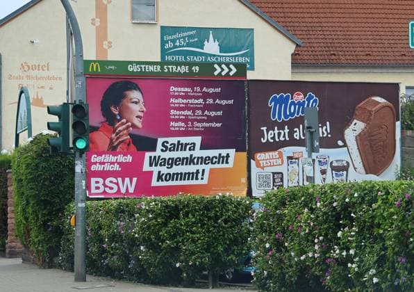 Election posters, August 18, 2026, Aschersleben, election posters for the state election on September 6, 2026, in Saxony-Anhalt: a large-scale poster of Sahra Wagenknecht (BSW) announcing campaign dates, next to it a promotional poster for Monte