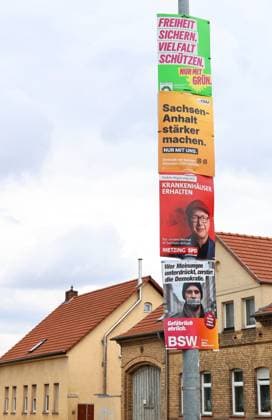Election posters, August 18, 2026, Aschersleben; photos of election posters for the state election on September 6, 2026, in Saxony-Anhalt; election posters stacked on top of each other on a lamppost, here from Alliance ’90 The Greens: Secure freedom, protect diversity. Only with the Greens, Make the CDU in Saxony