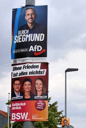 Election posters, August 18, 2026, Aschersleben, election posters for the state election on September 6, 2026, in Saxony-Anhalt: Election posters overlapping on a lamppost, shown here from the AfD (Ulrich Siegmund) and the BSW ( Without Peace, Everything Is Nothing; Dangerously Honest by Thomas Schulze), Sahra Wagenknecht, and Claudia Wittig
