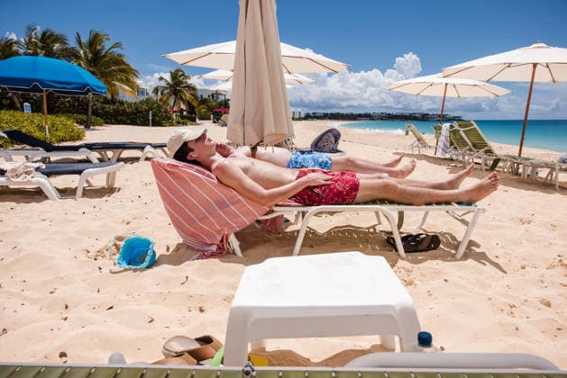 Two young men sunbathing on a tropical beach The Valley, Anguilla R_EMJA260819-2089598-01 ,model released, Symbolfoto ,property released