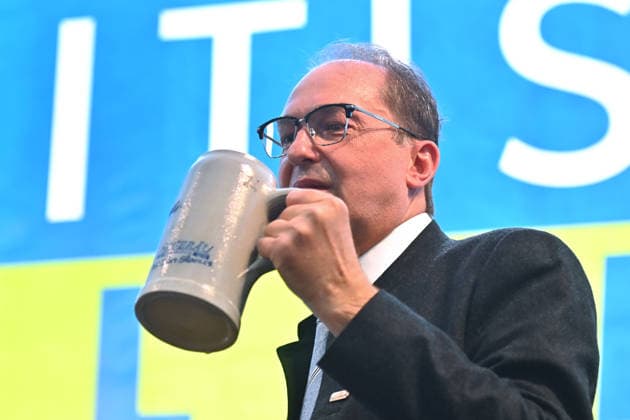 Federal Minister of the Interior Alexander DOBRINDT drinks a Mass of beer from a Masskrug at the Politischer Gillamoos on September 7, 2026, in Abensberg,