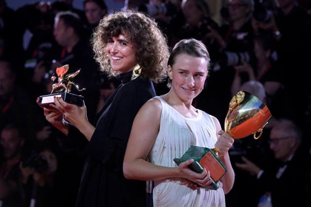 Mathilde Arcel and May el-Toukhy pose with the Coppa Volpi for Best Actress Award and with the Golden Lion for the Best Film Award for Woman Unknown at the Winners Photocall during the 83rd Venice International Film Festival at Sala Grande on September 12, 2026 in Venice, Italy.  VEN20260912812 RoccoxSpaziani