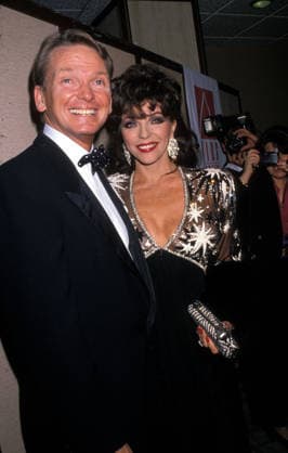 March 3, 1989, Los Angeles, California, USA; Actress JOAN COLLINS and fashion designer BOB MACKIE attend the Benefit for AIDS event 1989. Los Angeles USA  - ZUMAl19_ 19890303_mar_l19_260 Copyright: xLauraxLuongox