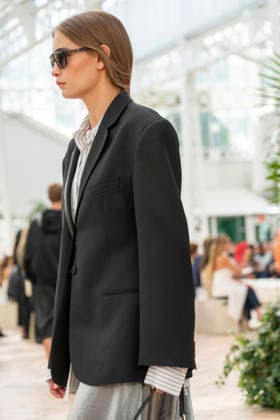 Models present creations from Adolfo Dominguez s Croma collection for spring-summer 2027 during Mercedes-Benz Fashion Week Madrid. Under the creative direction of Tiziana Domínguez, the Galician label, marking its 50th anniversary, remained faithful to its signature codes, showing pronounced asymmetry, scarves worked into both menswear and womenswear, sequins and textile appliques, alongside organic cotton denim dyed in tangerine tones and mini-pleated men s trousers. September 14,2026. (20260914867)