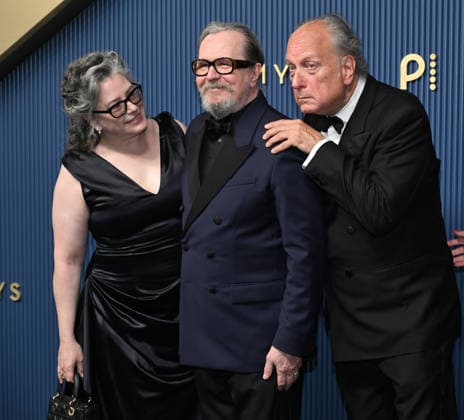 Gary Oldman,center, with his wife Gisele Schmidt and Douglas Urbansky arrive for the 78th annual Primetime Emmy Awards at the Peacock Theater in Los Angeles on Monday, September 14, 2026.  LAP20260914024 JohnxMcCoy