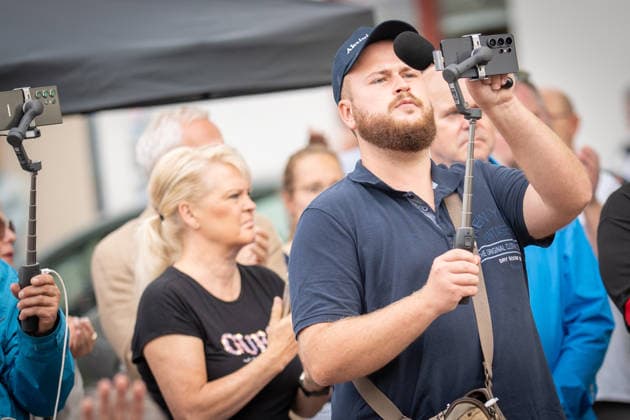 Live streamer Matthäus Westfal, known as Aktivist Mann, at the AfD campaign event in Bad Doberan for the 2026 state election in Mecklenburg-Western Pomerania, wearing a dark blue top; Bad Doberan, Mecklenburg-Western Pomerania, Germany, Market Square