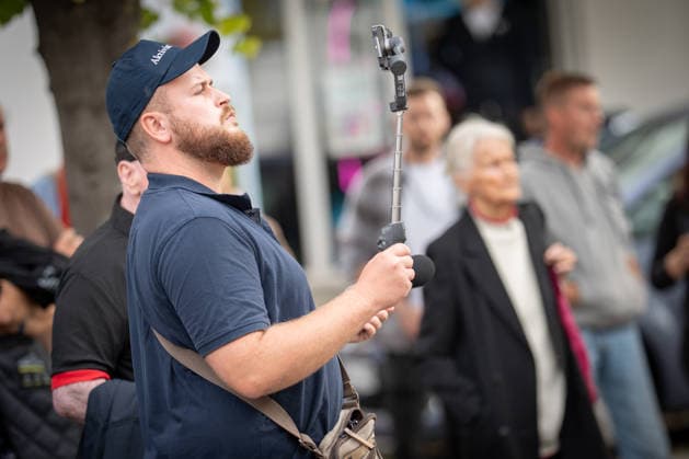 Live streamer Matthäus Westfal, known as Aktivist Mann, at the AfD campaign event in Bad Doberan for the 2026 state election in Mecklenburg-Western Pomerania, wearing a dark blue top; Bad Doberan, Mecklenburg-Western Pomerania, Germany, Market Square