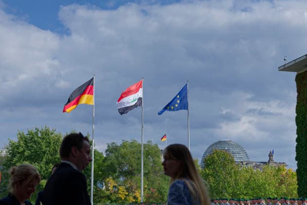 Flags of Germany, Iraq, and the EU September 15, 2026, Berlin, Germany: Federal Chancellor Friedrich Merz (CDU) welcomes Iraqi Prime Minister Ali Faleh Al Zaidi with military honors at the Chancellery. Pictured: the flags flying at the Chancellery