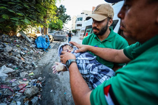 11 Palestinians killed as damaged six-story building collapses onto displaced tents in Gaza GAZA CITY, GAZA, PALESTINE - SEPTEMBER 16: (EDITOR S NOTE: Image depicts death) Rescue workers extract the bodies of victims from the rubble after a damaged six-story building collapsed in the Al-Sinaa area of southwestern Gaza City, Gaza, Palestine on September 16, 2026. The building, previously damaged during Israeli airstrikes, collapsed onto neighboring tents housing displaced Palestinians, leaving at least 11 people dead, including five children, and injuring 14 others as civil defense and municipal teams continue search-and-rescue operations. Hamza Z. H. Qraiqea Anadolu Gaza City Gaza. Editorial use only. Please get in touch for any other usa  Copyright: x2026xAnadoluxHamzaxZ.xH.xQraiqeax