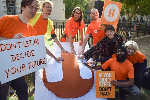 September 16, 2026, London, England, United Kingdom: Protesters press a huge Pause button outside Downing Street during a demonstration by the group Pause AI, urging the government to limit the development of artificial intelligence amid warnings that it could lead to human extinction. London United Kingdom - ZUMAv130 20260916_zip_v130_004 Copyright: xVukxValcicx