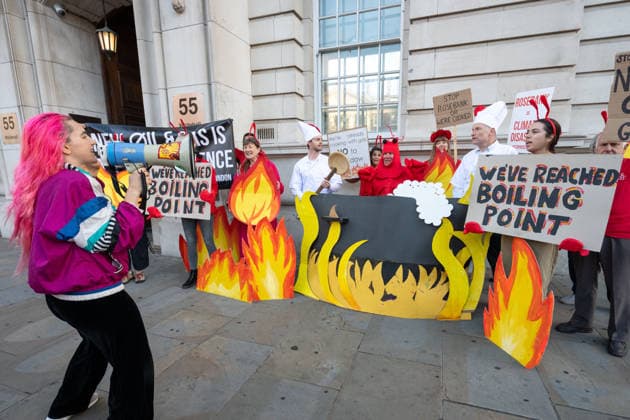 September 16, 2026, London, United Kingdom: Activists from Fossil Free London stage a protest outside the Department for Energy Security and Net Zero (DESNZ) in Whitehall. The protest feature a giant lobster inside a cooking pot surrounded by demonstrators dressed as ˜Shell chefs™. The lobster represents a planet being pushed towards dangerous levels of warming, while the ˜Shell chefs™ represent the fossil fuel industry continuing to pursue new oil and gas projects. The action comes as the Government faces pressure over new North Sea oil and gas developments, including the Rosebank and Jackdaw fields. London United Kingdom - ZUMAs197 20260916_aaa_s197_032 Copyright: xAndreaxDomeniconix