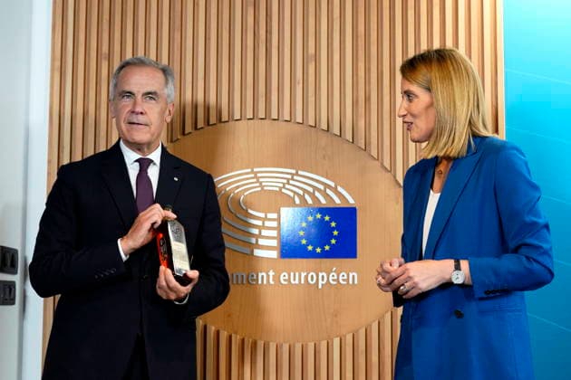 September 16, 2026, Strasbourg, France: Prime Minister Mark Carney holds up a bottle of maple syrup labelled with his name and title, as he gives it to President of the European Parliament Roberta Metsola as they exchange gifts during a bilateral meeting at the European Parliament in Strasbourg, France, on Wednesday, Sept. 16, 2026. Strasbourg France  - ZUMAc35_ 20260916_zaf_c35_045 Copyright: xJustinxTangx