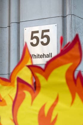 September 16, 2026, London, United Kingdom: Fire props are placed in front of the building plaque reading 55 Whitehall during a Fossil Free London protest outside the Department for Energy Security and Net Zero (DESNZ) in Whitehall. The protest feature a giant lobster inside a cooking pot surrounded by demonstrators dressed as ˜Shell chefs™. The lobster represents a planet being pushed towards dangerous levels of warming, while the ˜Shell chefs™ represent the fossil fuel industry continuing to pursue new oil and gas projects. The action comes as the Government faces pressure over new North Sea oil and gas developments, including the Rosebank and Jackdaw fields. London United Kingdom - ZUMAs197 20260916_aaa_s197_036 Copyright: xAndreaxDomeniconix