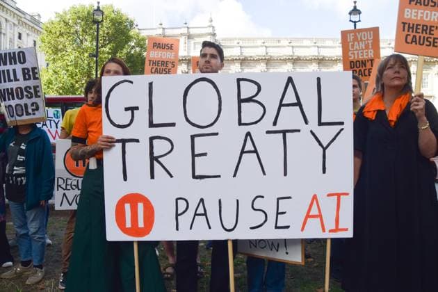 September 16, 2026, London, United Kingdom: Protesters hold a banner calling for a global treaty on AI during the demonstration by the group Pause AI outside Downing Street..The protesters are urging the government to pause the development of artificial intelligence amid warnings that it could lead to human extinction. London United Kingdom - ZUMAs197 20260916_aaa_s197_040 Copyright: xVukxValcicx
