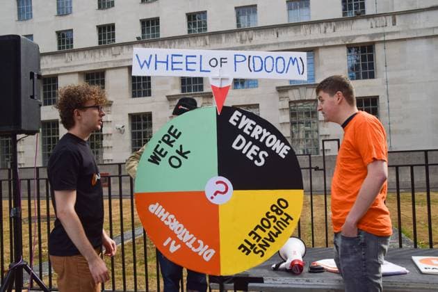 September 16, 2026, London, United Kingdom: Protesters spin the Wheel of the Probability of Doom during the demonstration by the group Pause AI outside Downing Street..The protesters are urging the government to pause the development of artificial intelligence amid warnings that it could lead to human extinction. London United Kingdom - ZUMAs197 20260916_aaa_s197_047 Copyright: xVukxValcicx