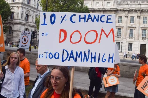 September 16, 2026, London, United Kingdom: A protester holds a placard stating 10 percent chance of doom is too damn high during the demonstration by the group Pause AI outside Downing Street..The protesters are urging the government to pause the development of artificial intelligence amid warnings that it could lead to human extinction. London United Kingdom  - ZUMAs197 20260916_aaa_s197_039 Copyright: xVukxValcicx