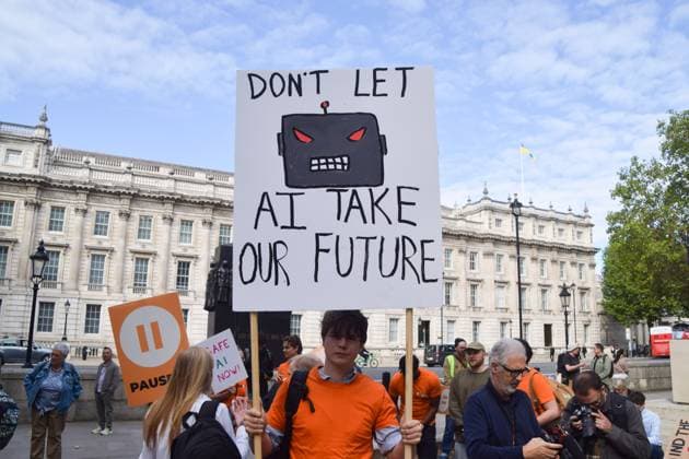 September 16, 2026, London, United Kingdom: A protester holds a Don t let AI take our future placard during the demonstration by the group Pause AI outside Downing Street..The protesters are urging the government to pause the development of artificial intelligence amid warnings that it could lead to human extinction. London United Kingdom  - ZUMAs197 20260916_aaa_s197_042 Copyright: xVukxValcicx