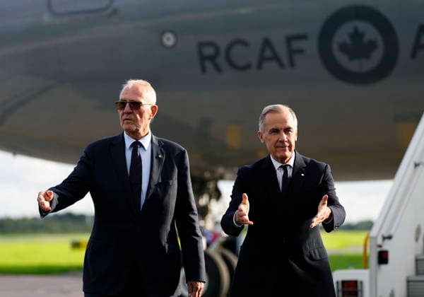 September 16, 2026, Manchester, United Kingdom: Prime Minister Mark Carney gestures as he is directed to his vehicle, after being welcomed by Bill Blair, High Commissioner for Canada in the United Kingdom, after arriving in Manchester, England, on Wednesday, Sept. 16, 2026, en route to Liverpool, where he will meet with British Prime Minister Andy Burnham. Manchester United Kingdom  - ZUMAc35_ 20260916_zaf_c35_087 Copyright: xJustinxTangx