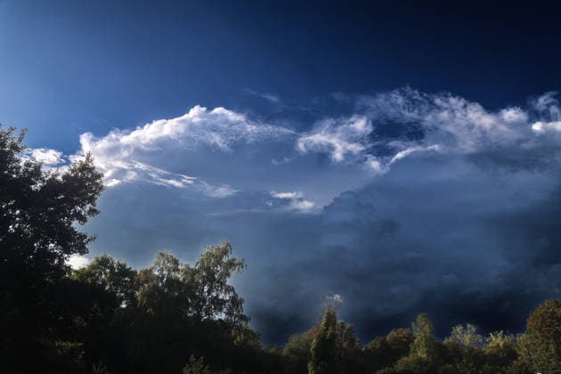 Moments Before a Thunderstorm: A thundercloud appears in all its grandeur and full force shortly after the start of meteorological fall, just a few minutes before a powerful thunderstorm in Essen, North Rhine-Westphalia, Germany