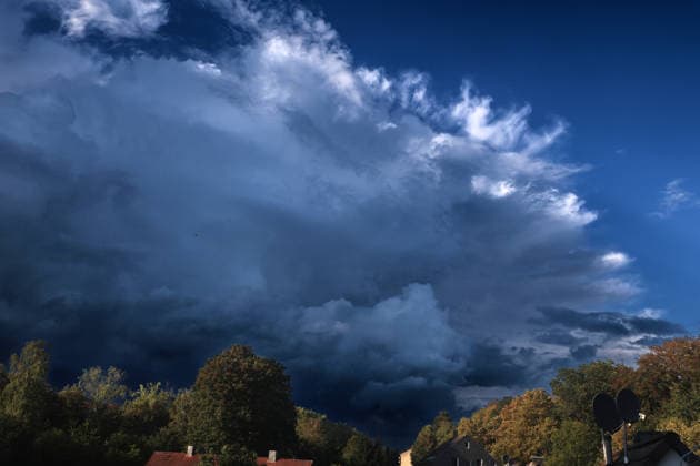 Moments Before a Thunderstorm: A thundercloud appears in all its grandeur and full force shortly after the start of meteorological fall, just a few minutes before a powerful thunderstorm in Essen, North Rhine-Westphalia, Germany